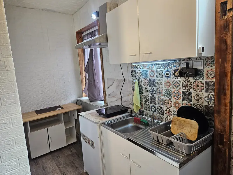 Kitchenette and folding table by the window